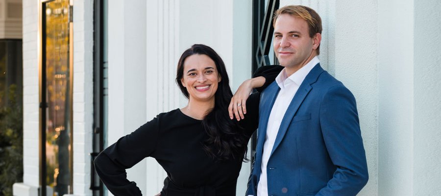 Award-winning real estate duo Brady and Alyssa Hammond on Artenzza Magazine cover, showcasing their journey from schoolteachers to TV personalities in Northeast Florida.